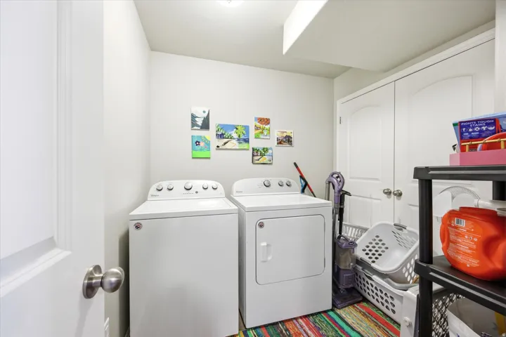 Laundry area featuring independent washer and dryer