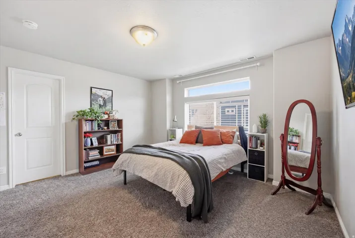 Bedroom with carpet flooring