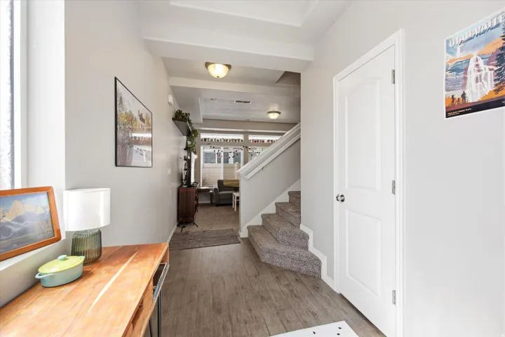 Entryway with stairway and dark wood-type flooring