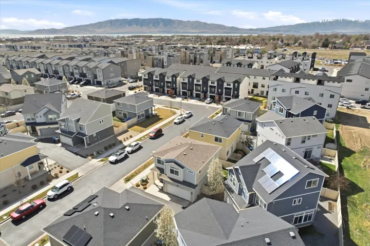 Aerial view of residential area featuring a mountain backdrop
