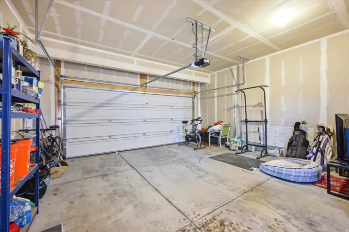 Garage featuring a garage door opener