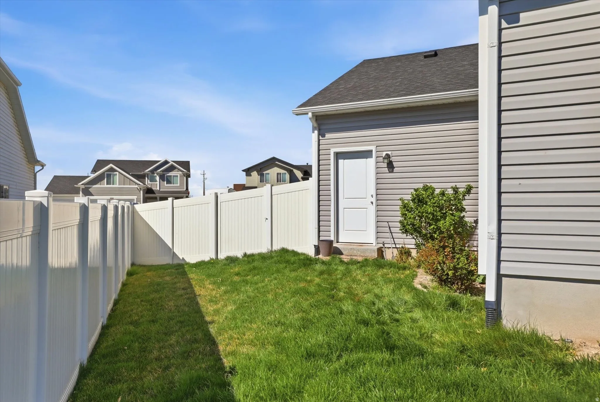 View of fenced backyard