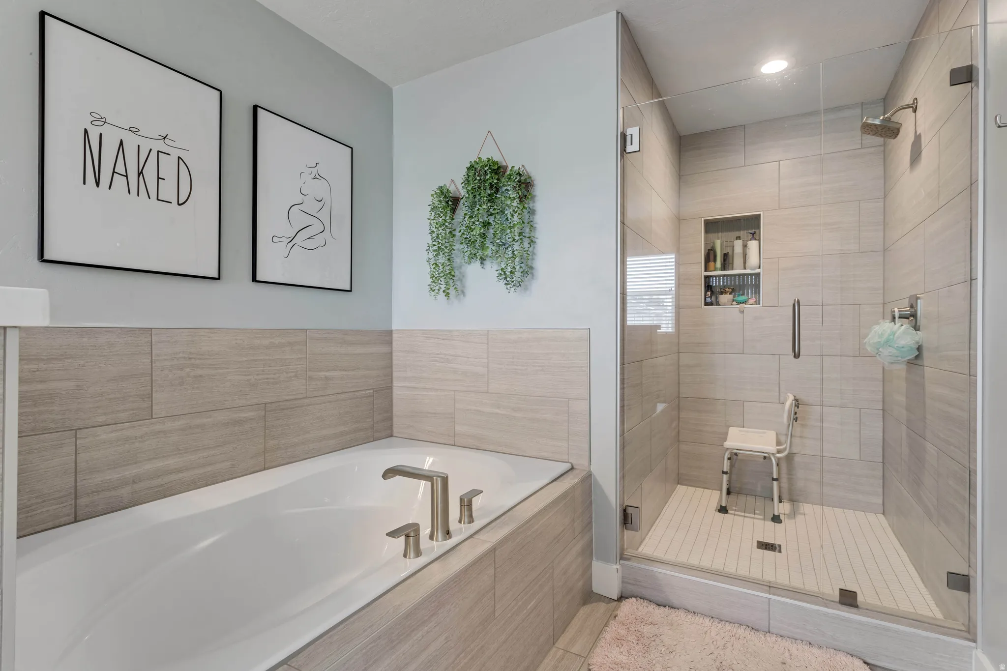 Bathroom featuring a garden tub, a shower stall, and recessed lighting