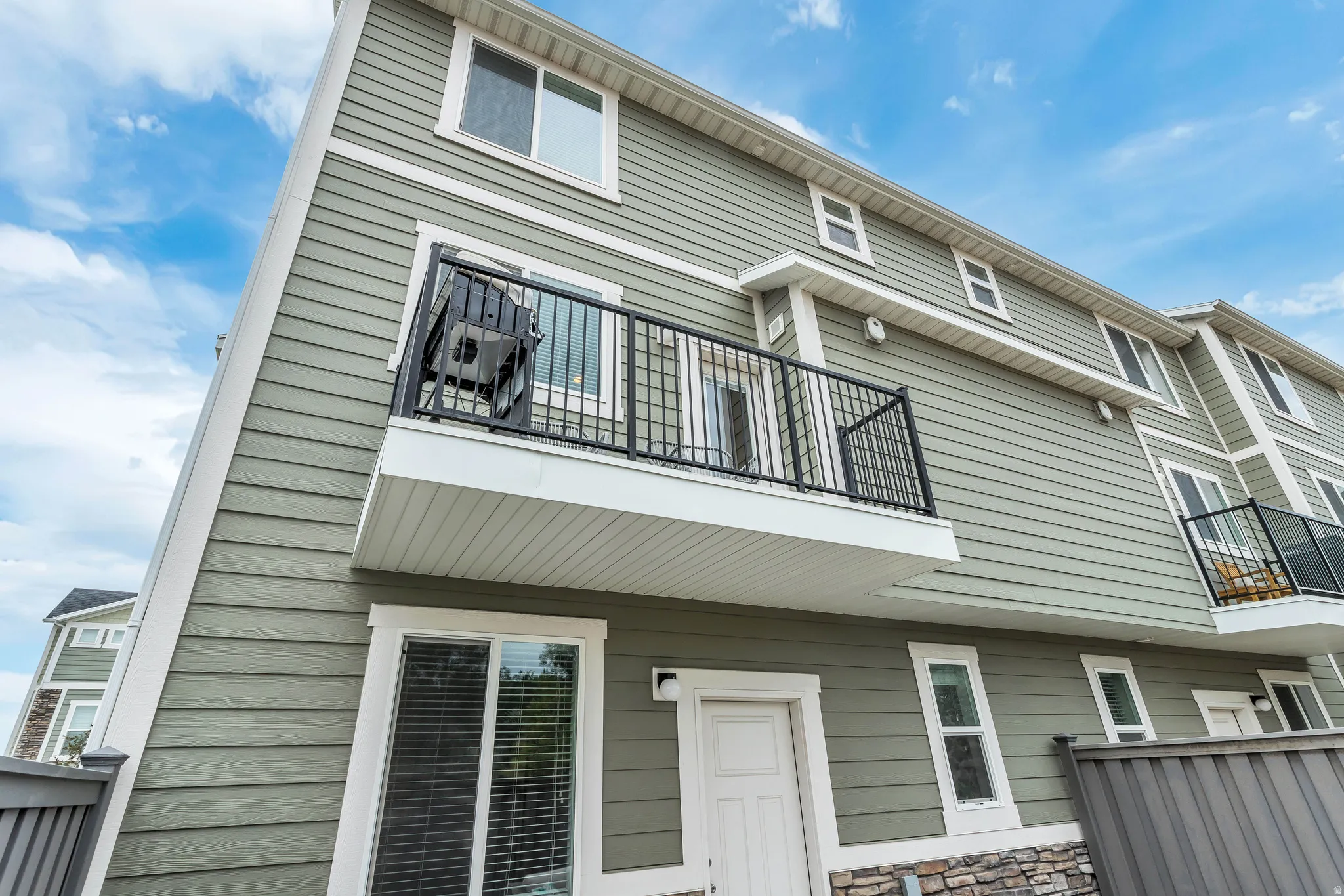 Rear view of house featuring a balcony
