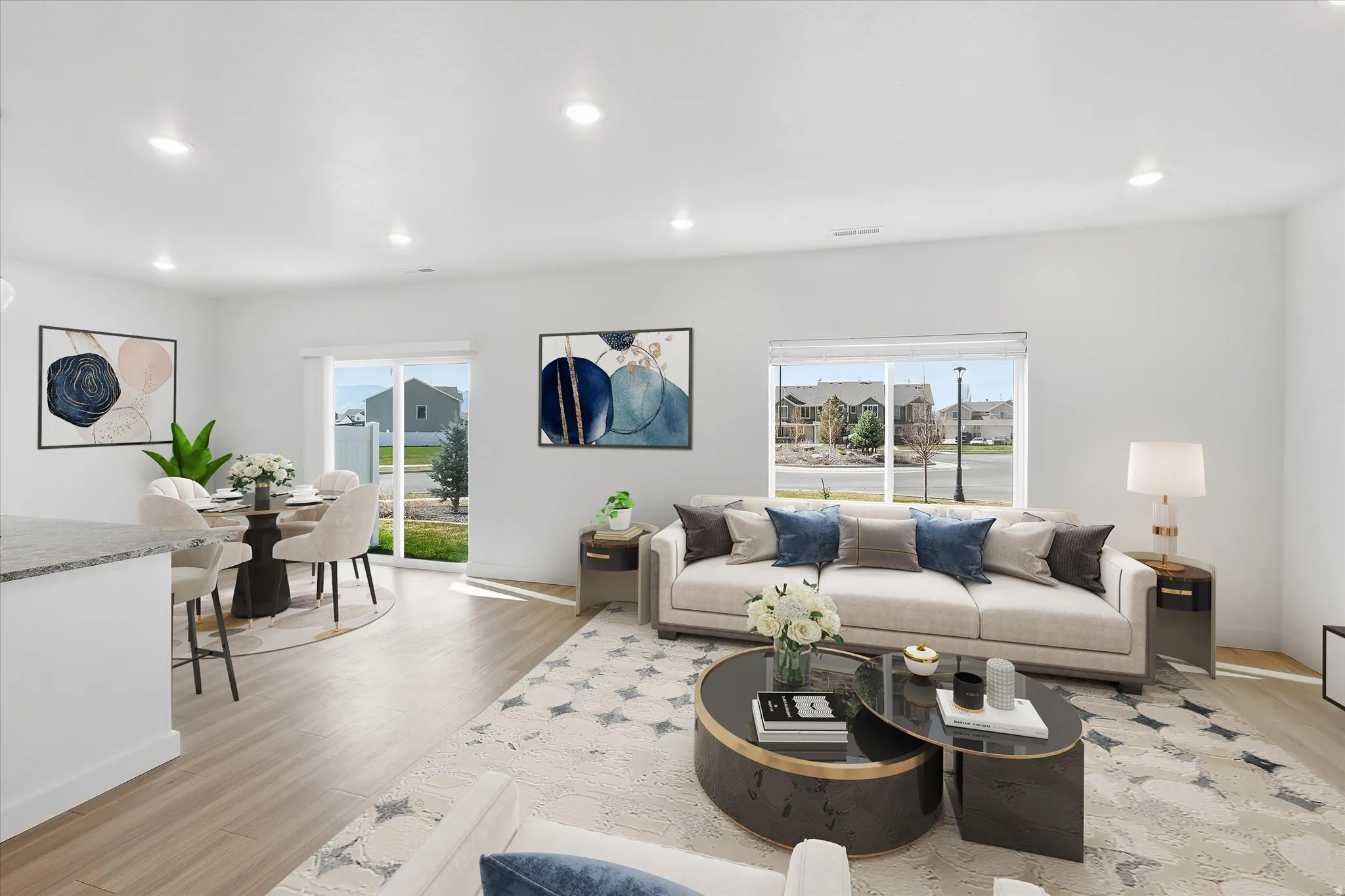 Living area featuring light wood-type flooring and recessed lighting