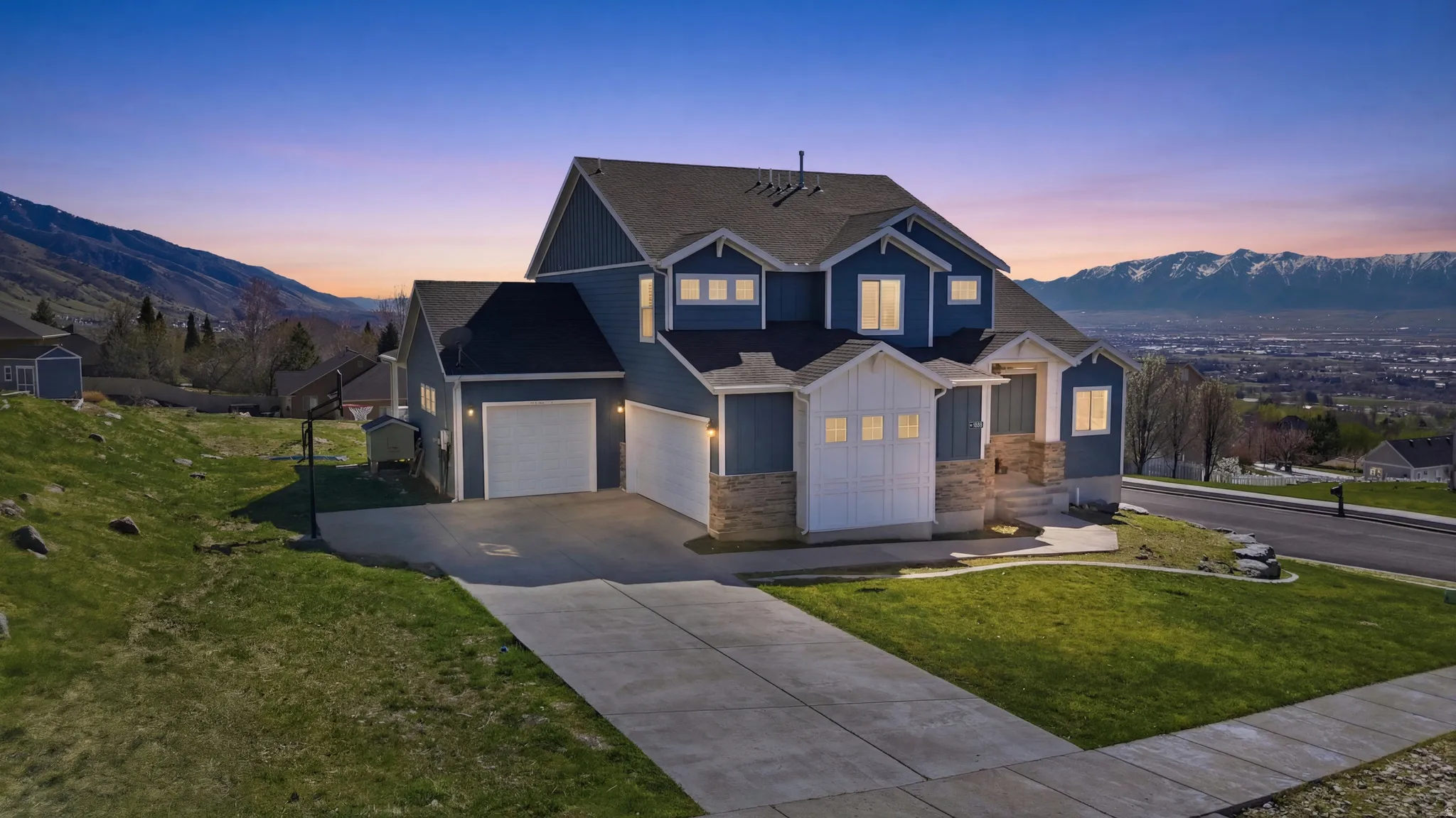 Contemporary two-story residence featuring blue siding and white trim