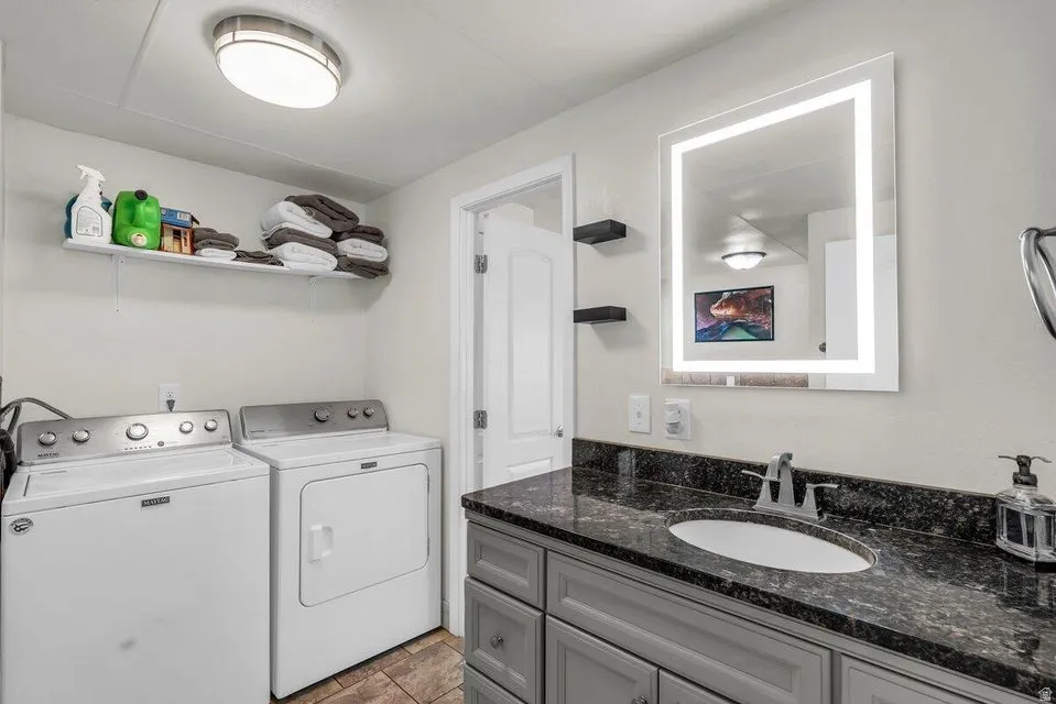 Laundry area with separate washer and dryer