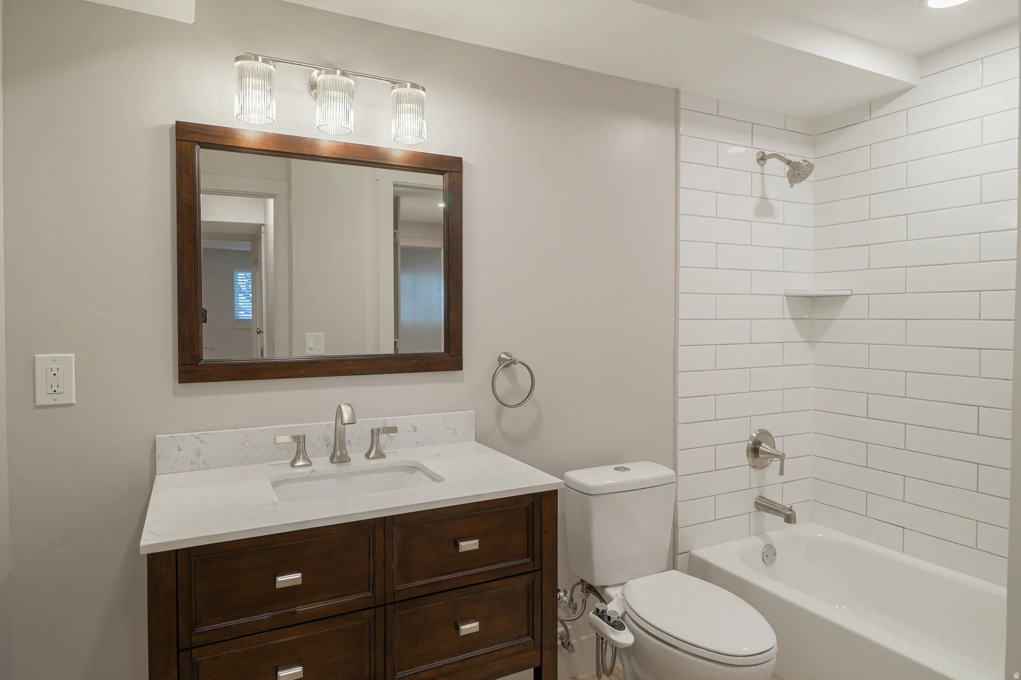 Bathroom with vanity and bathing tub / shower combination