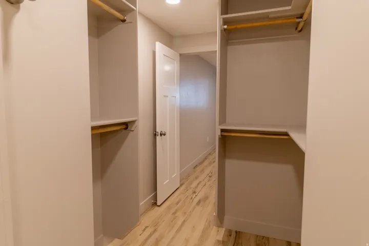 Walk in closet featuring light wood-style floors