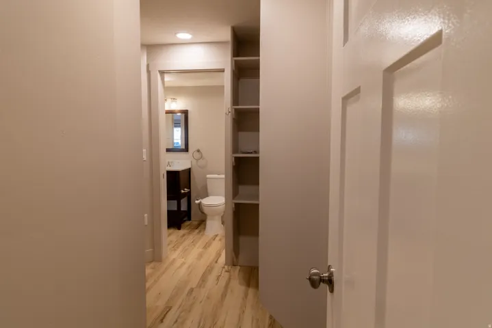 Hallway featuring light wood-style floors