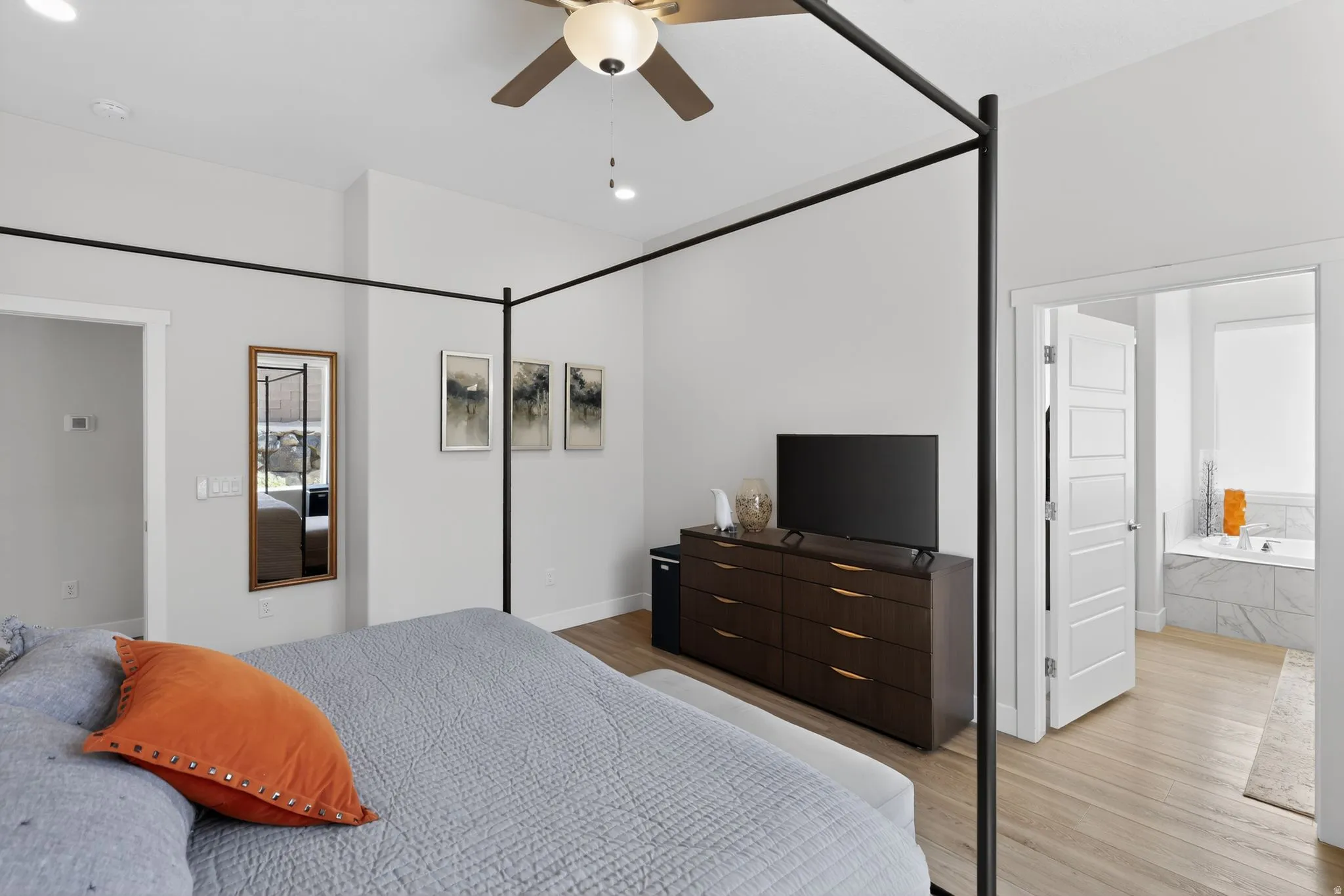 Bedroom featuring light wood-style floors, ceiling fan, and recessed lighting