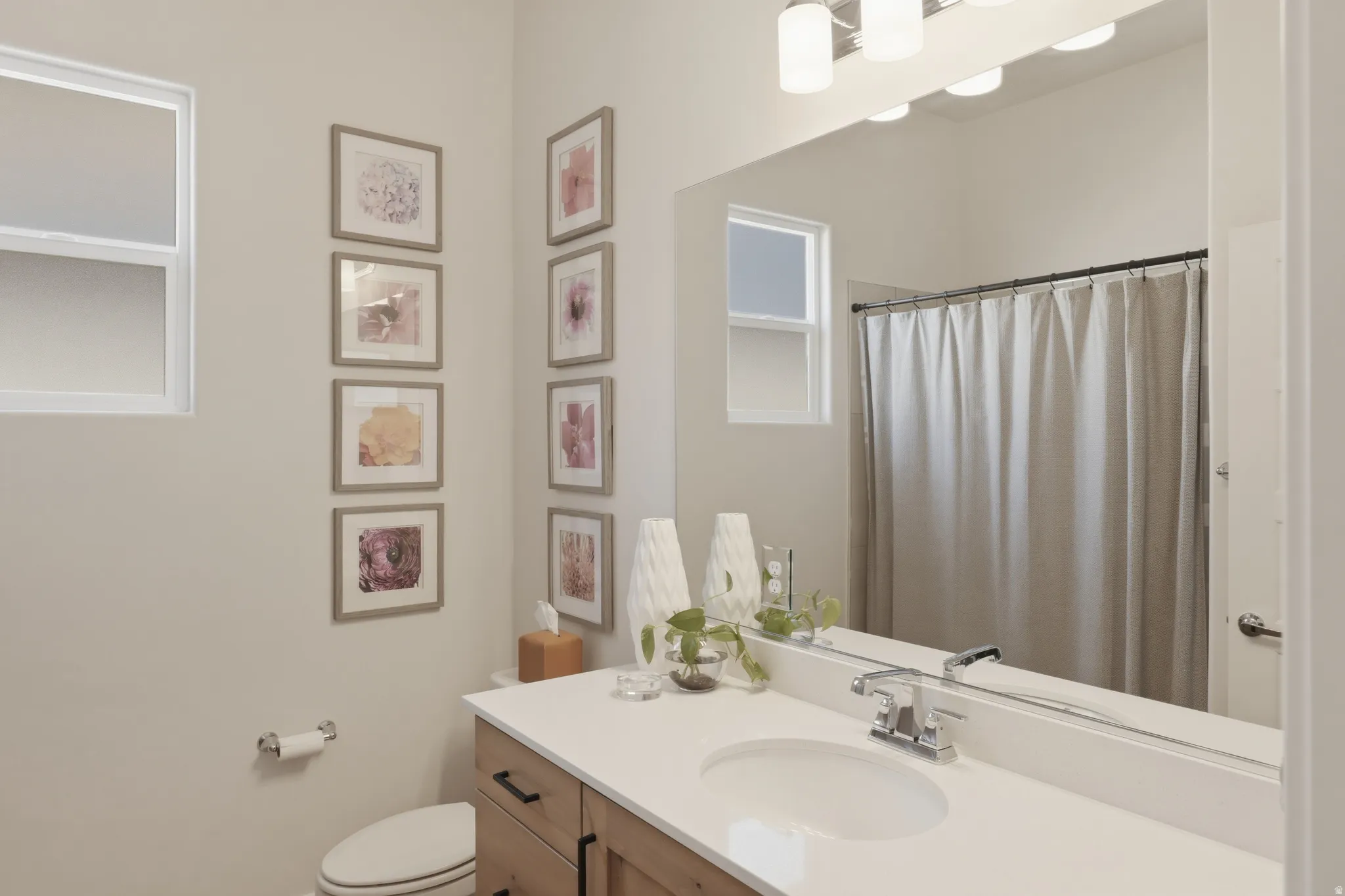 Bathroom featuring vanity and a shower with shower curtain