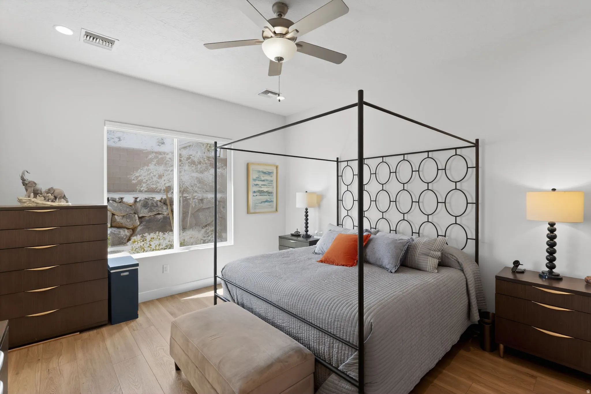 Bedroom featuring light wood-style floors and a ceiling fan