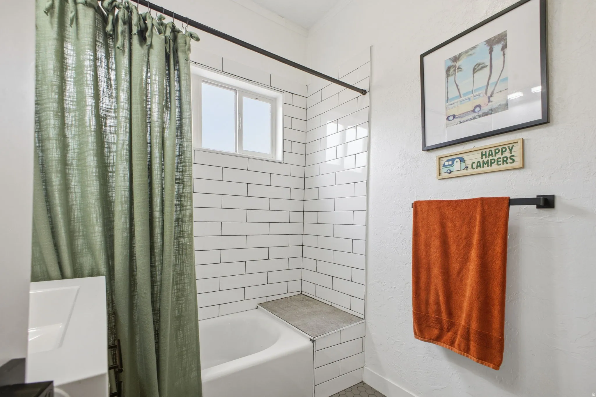 Bathroom with shower / bath combo with shower curtain and a textured wall