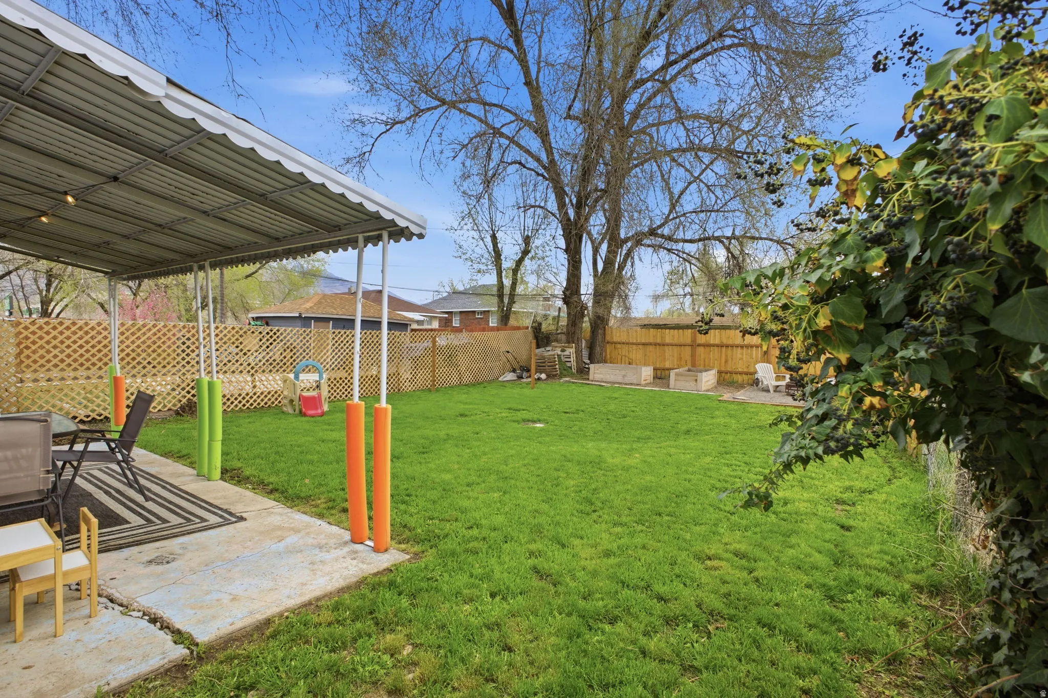 Fenced backyard with a patio
