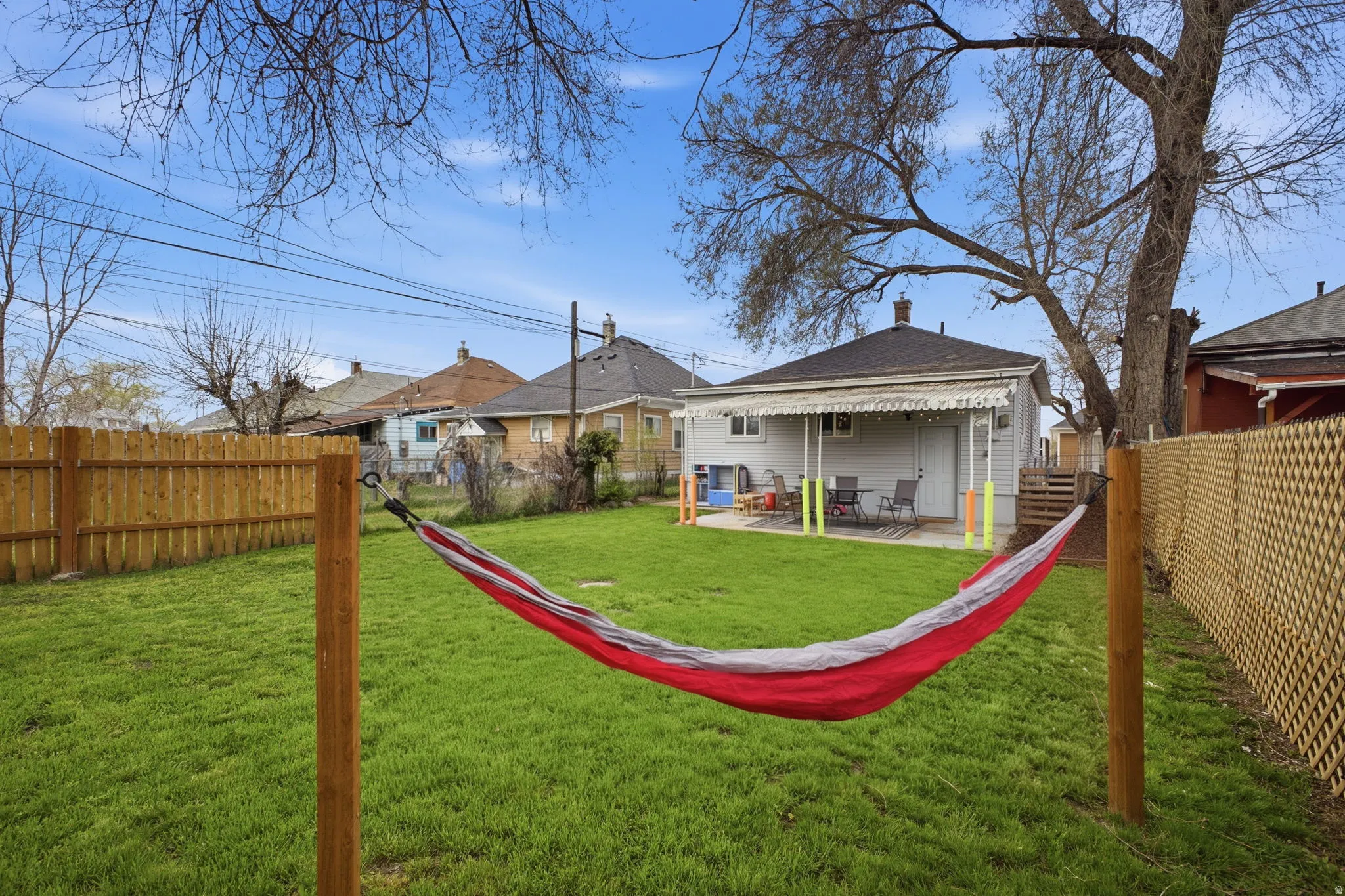 Fenced backyard with a patio area