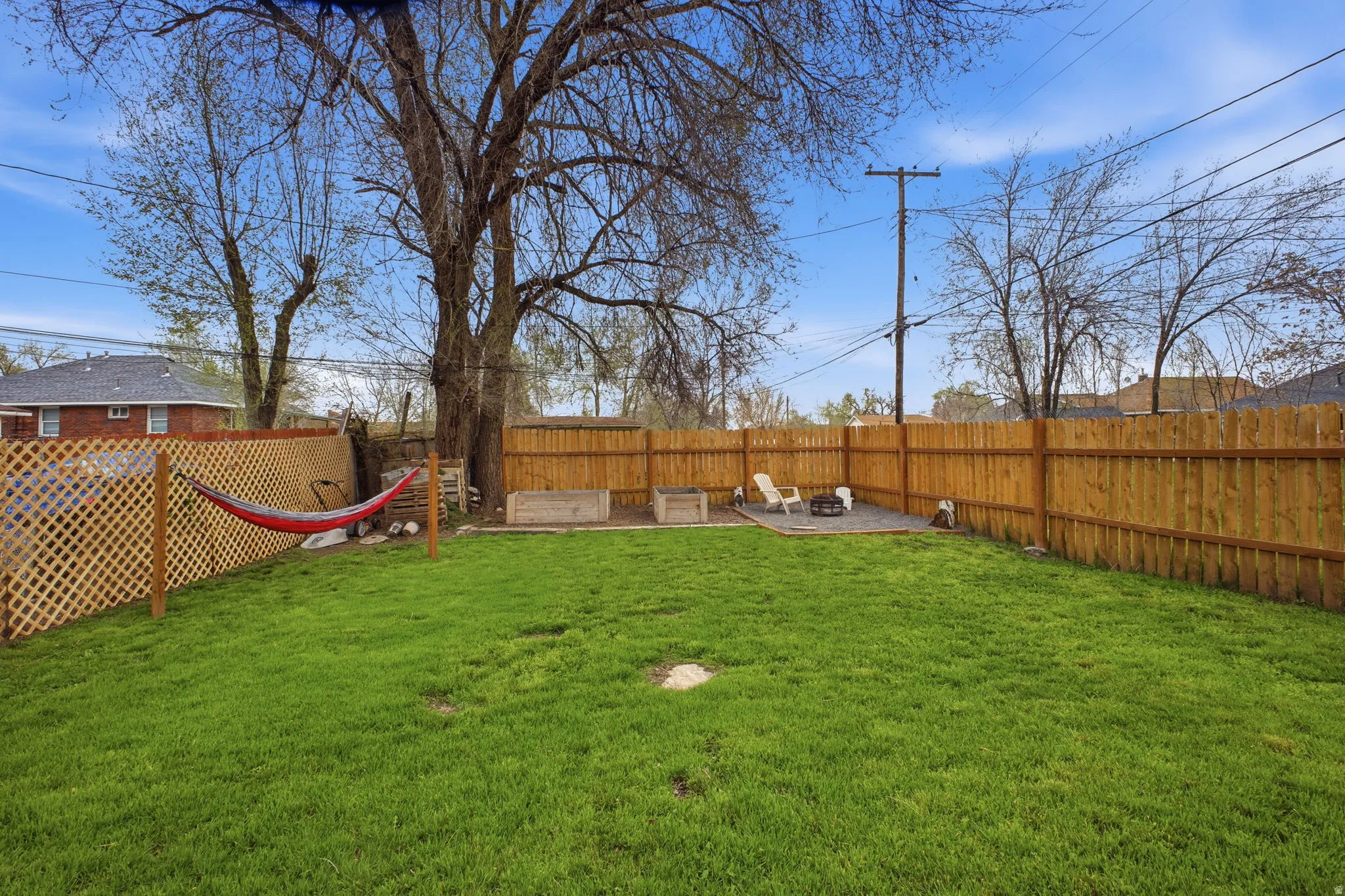 Fenced backyard with a patio area