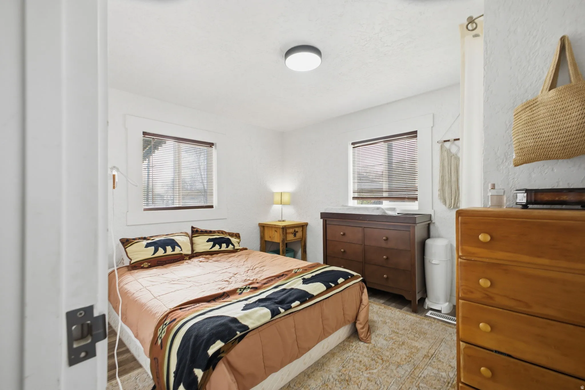 Bedroom featuring a textured wall