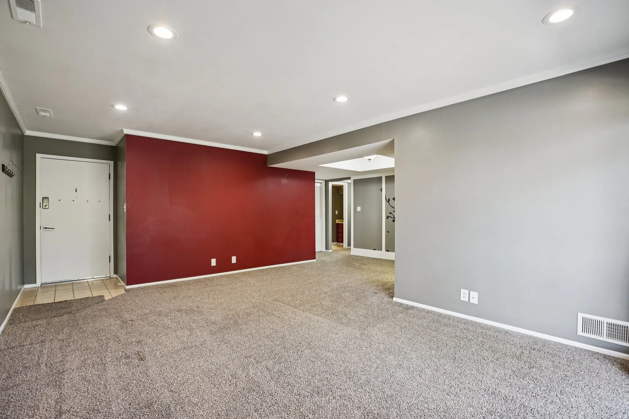Unfurnished room featuring recessed lighting, light colored carpet, and crown molding