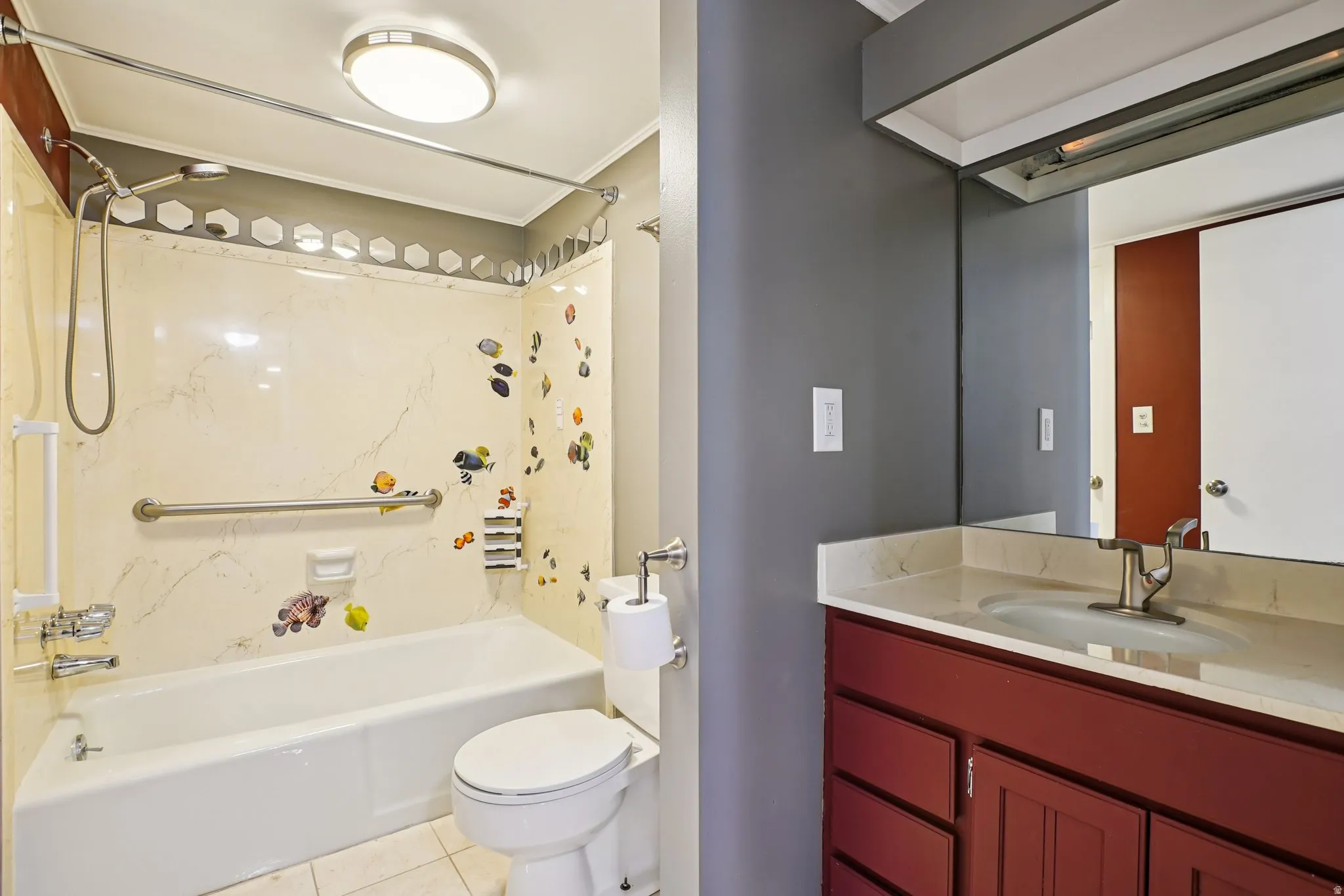 Full bath with vanity, washtub / shower combination, and light tile patterned floors