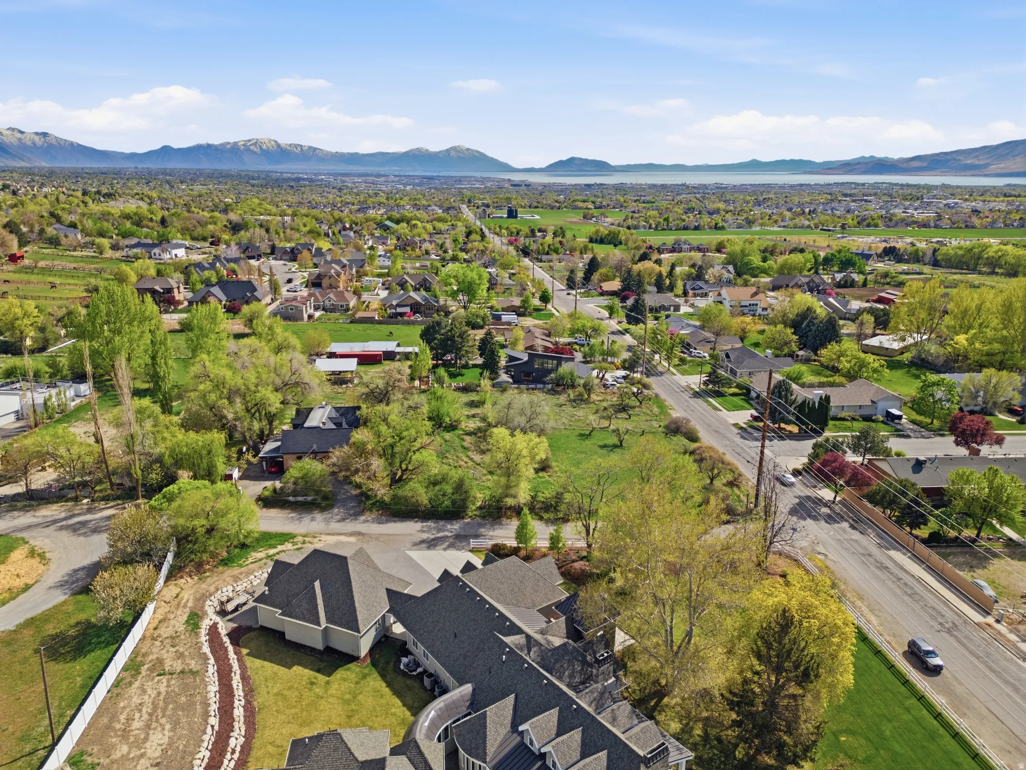 Aerial perspective of suburban property with mountains