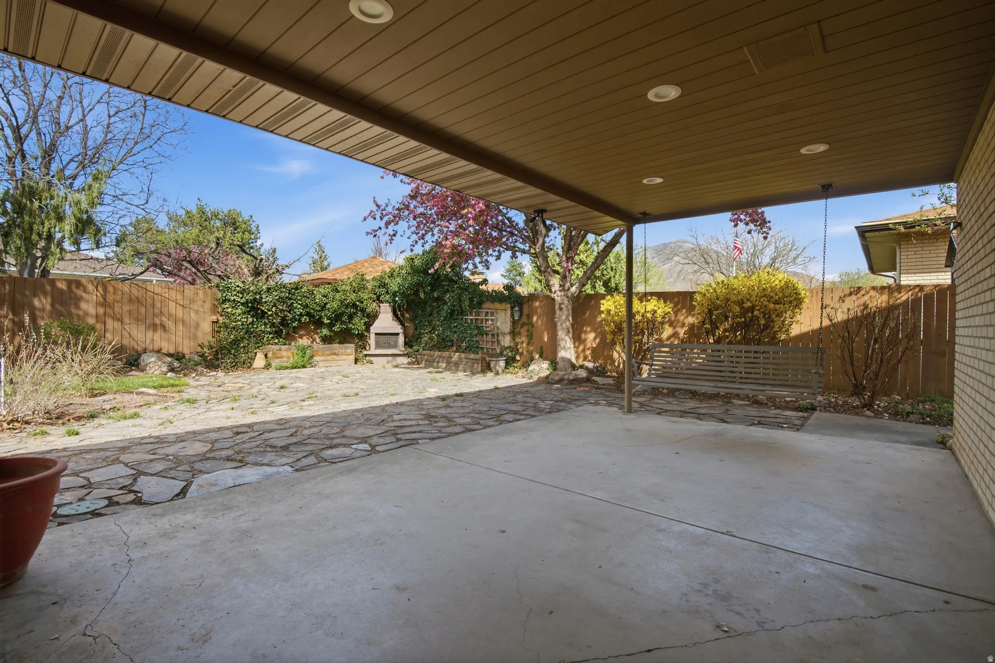 Fenced backyard with a patio area
