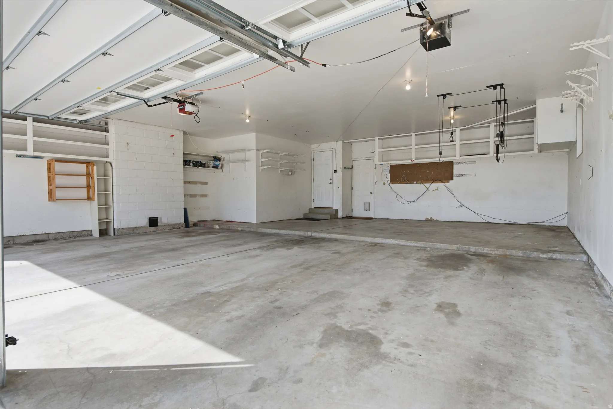 Garage featuring a garage door opener