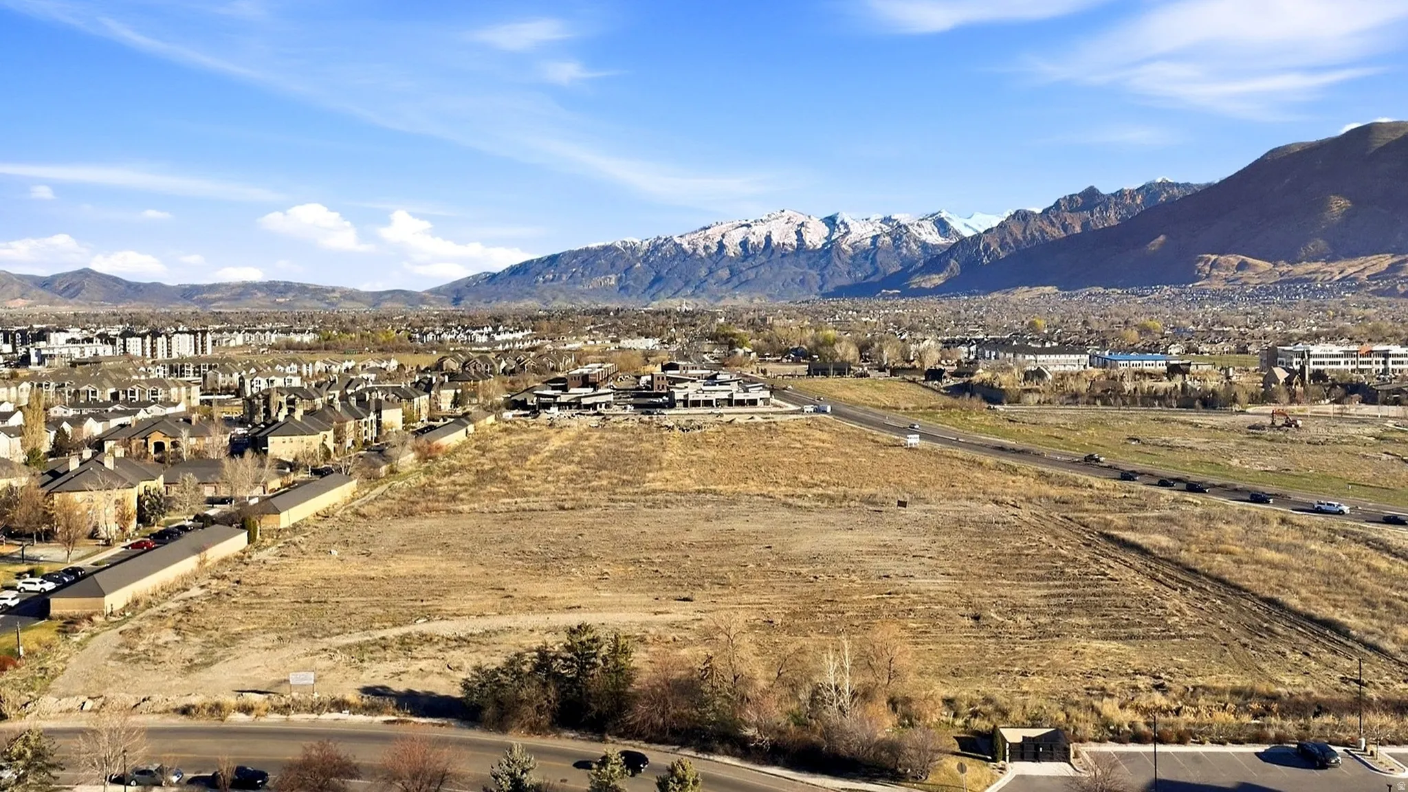 View of mountain background featuring nearby suburban area