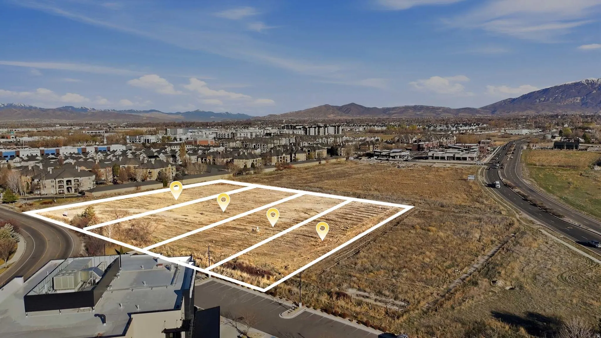 Aerial perspective of suburban area featuring a mountain backdrop