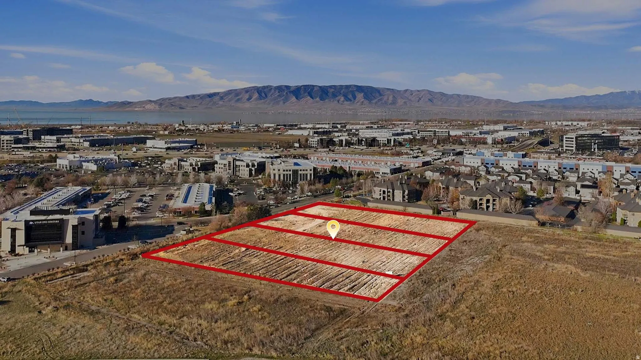 Aerial view of property's location featuring property boundaries highlighted and a mountainous background