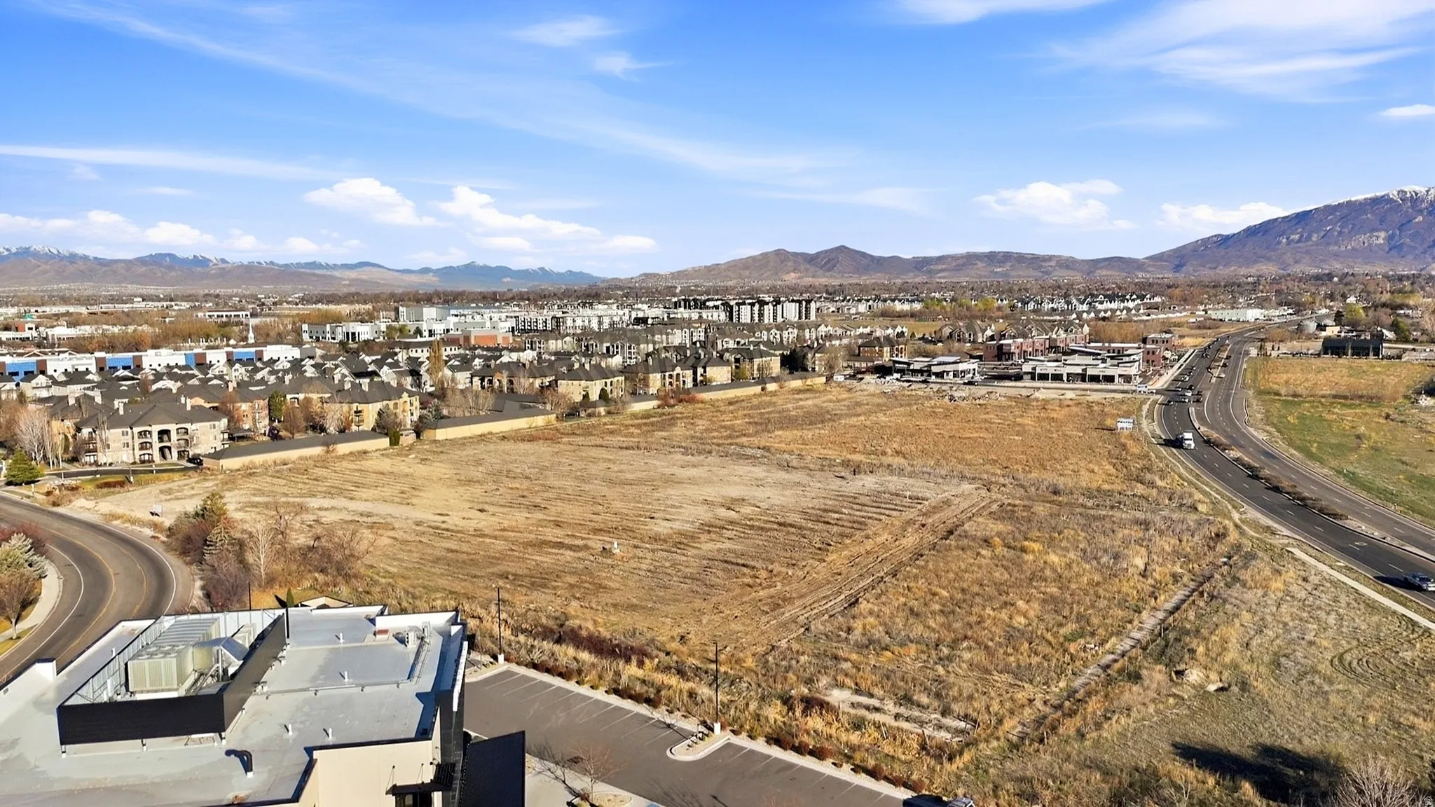 Aerial perspective of suburban area featuring a mountain backdrop