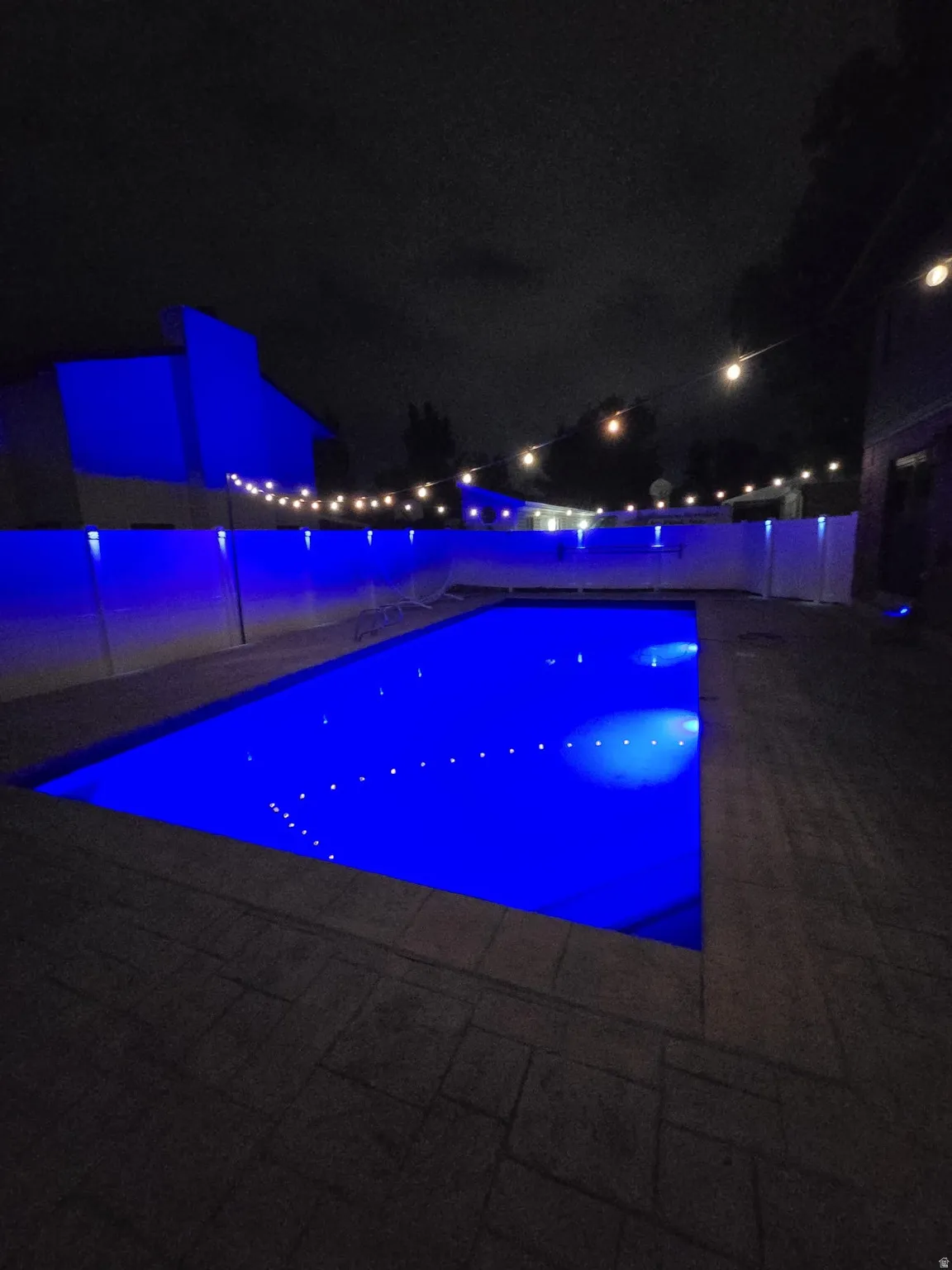 View of pool at twilight