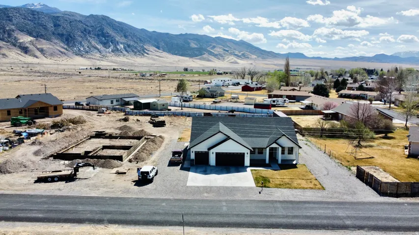 Aerial perspective of suburban area featuring a mountainous background