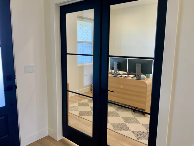 Doorway featuring french doors and wood finished floors