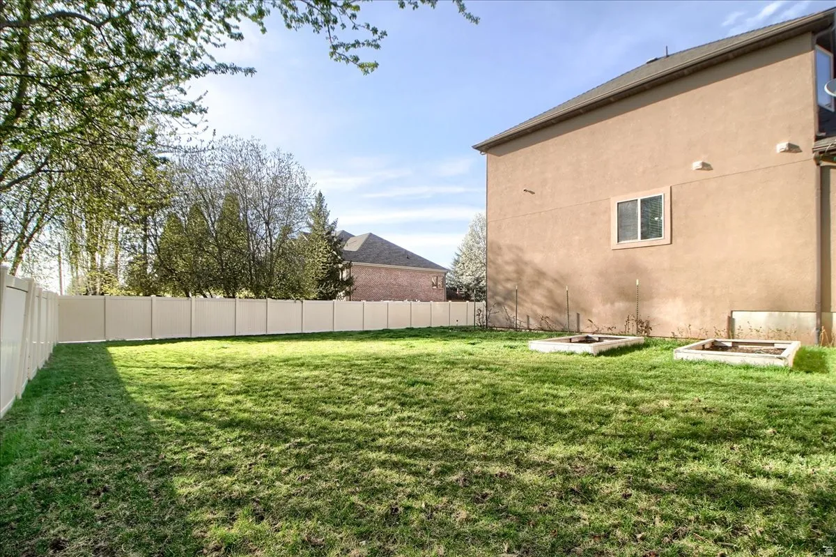 View of fenced backyard