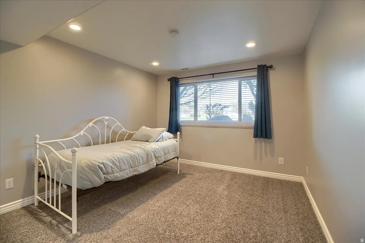 Bedroom featuring carpet floors and recessed lighting