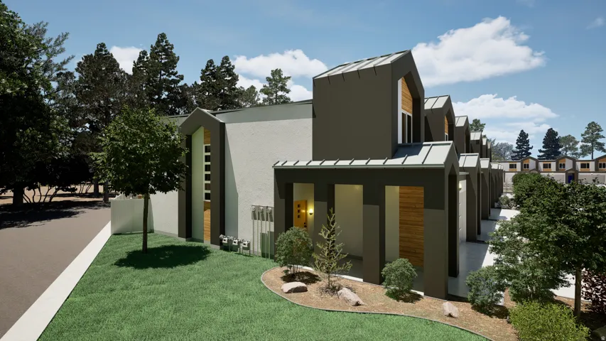 View of side of home with a standing seam roof, stucco siding, and a lawn