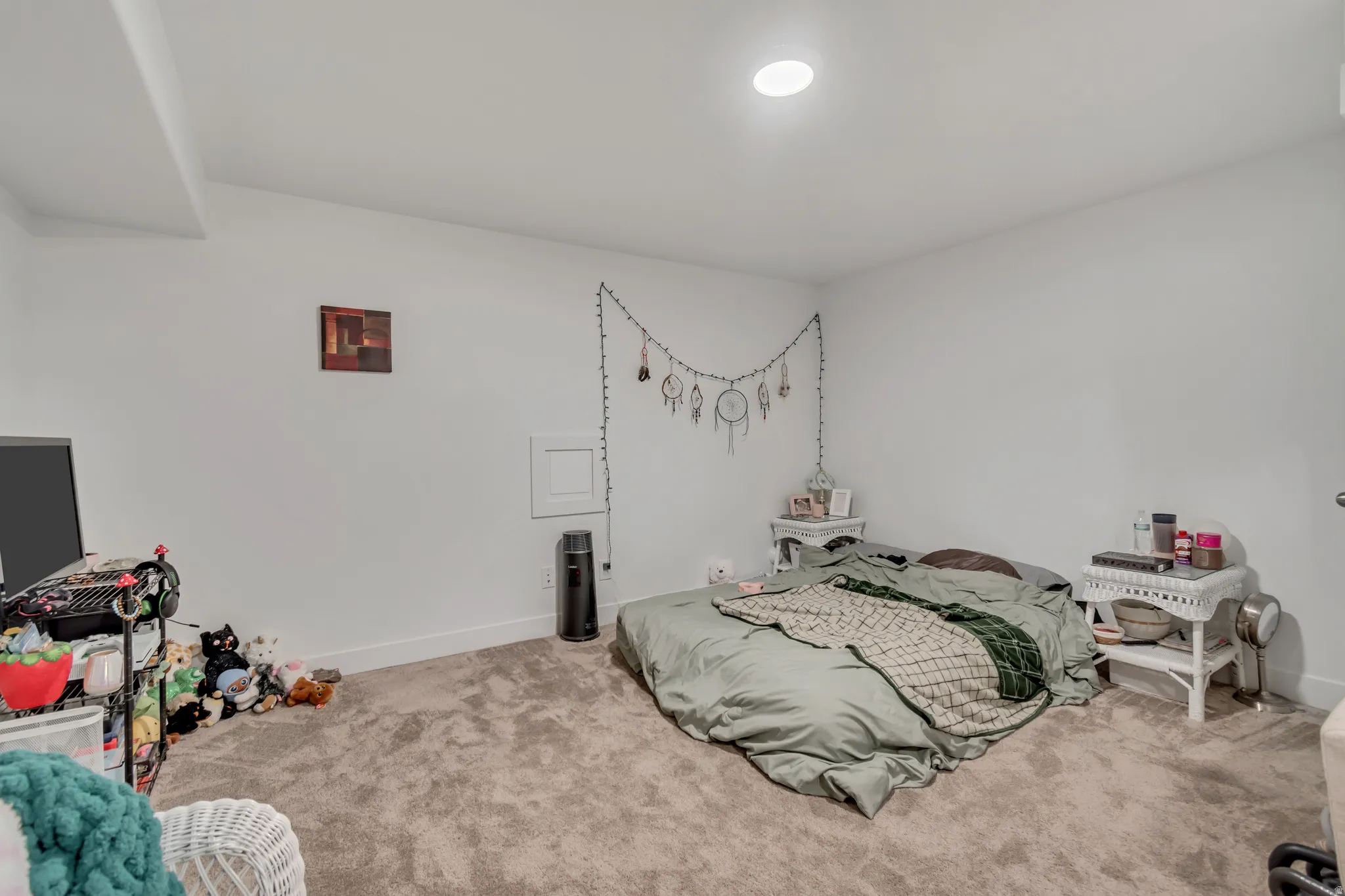 Carpeted bedroom featuring baseboards