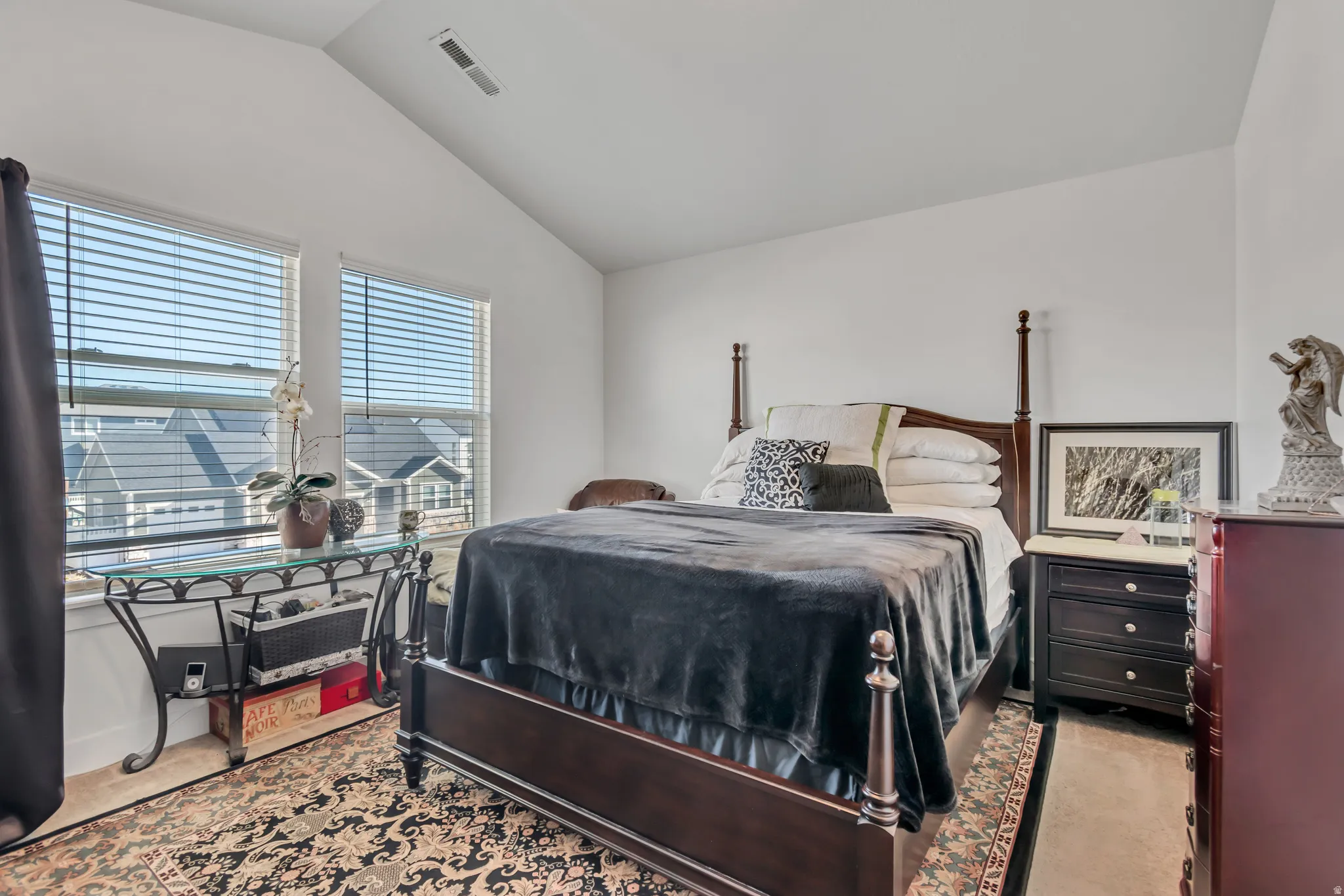 Bedroom featuring vaulted ceiling