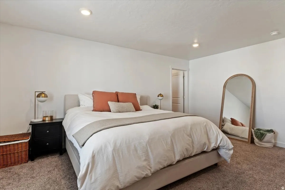 Carpeted bedroom featuring recessed lighting