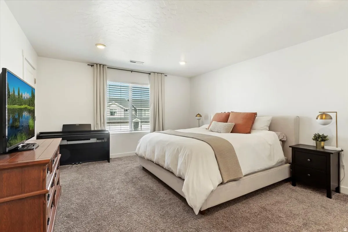Bedroom featuring carpet flooring and recessed lighting