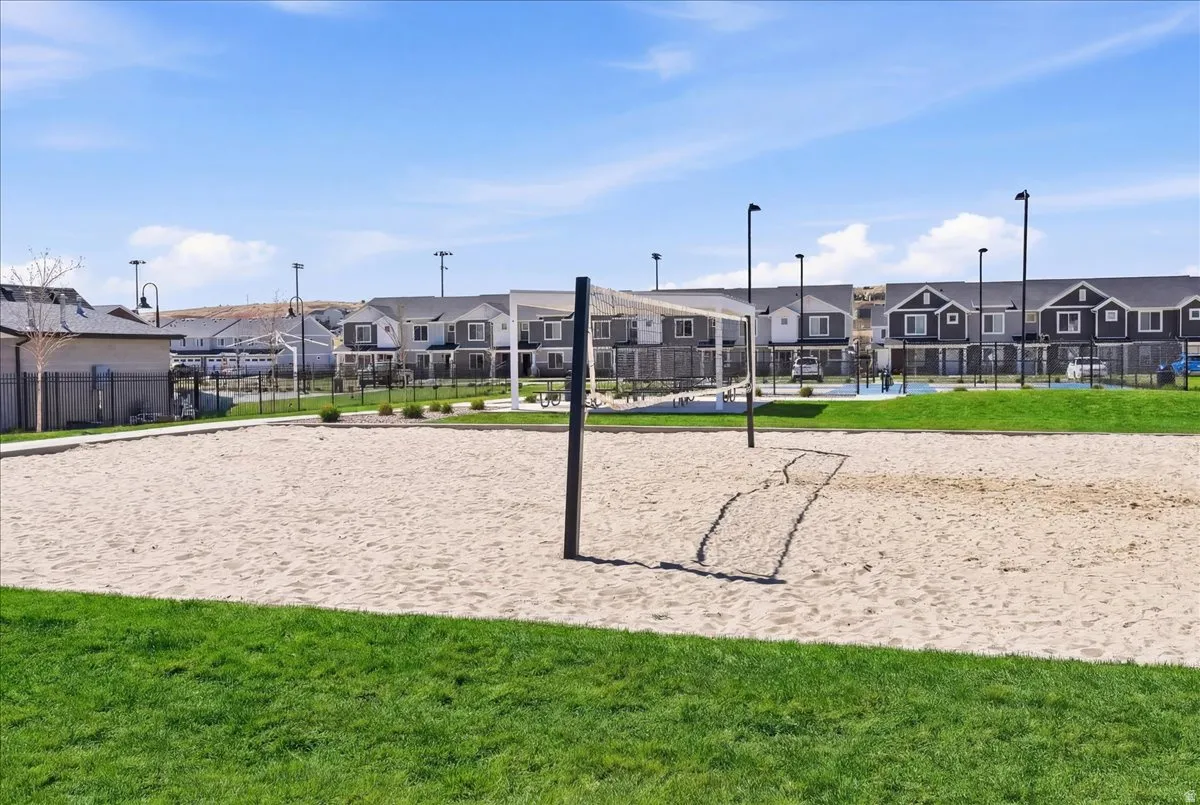 Surrounding community featuring volleyball court and a residential view