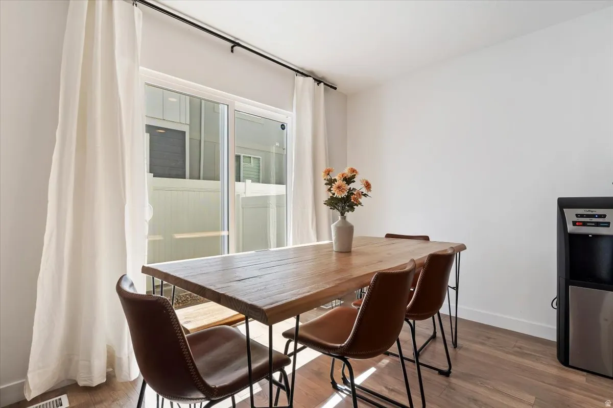Dining space with wood finished floors
