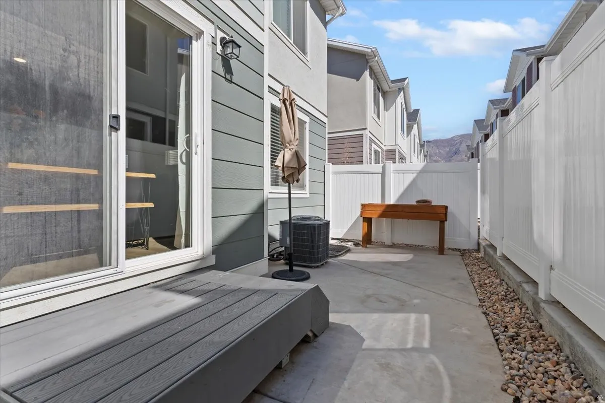 Fenced backyard with a patio