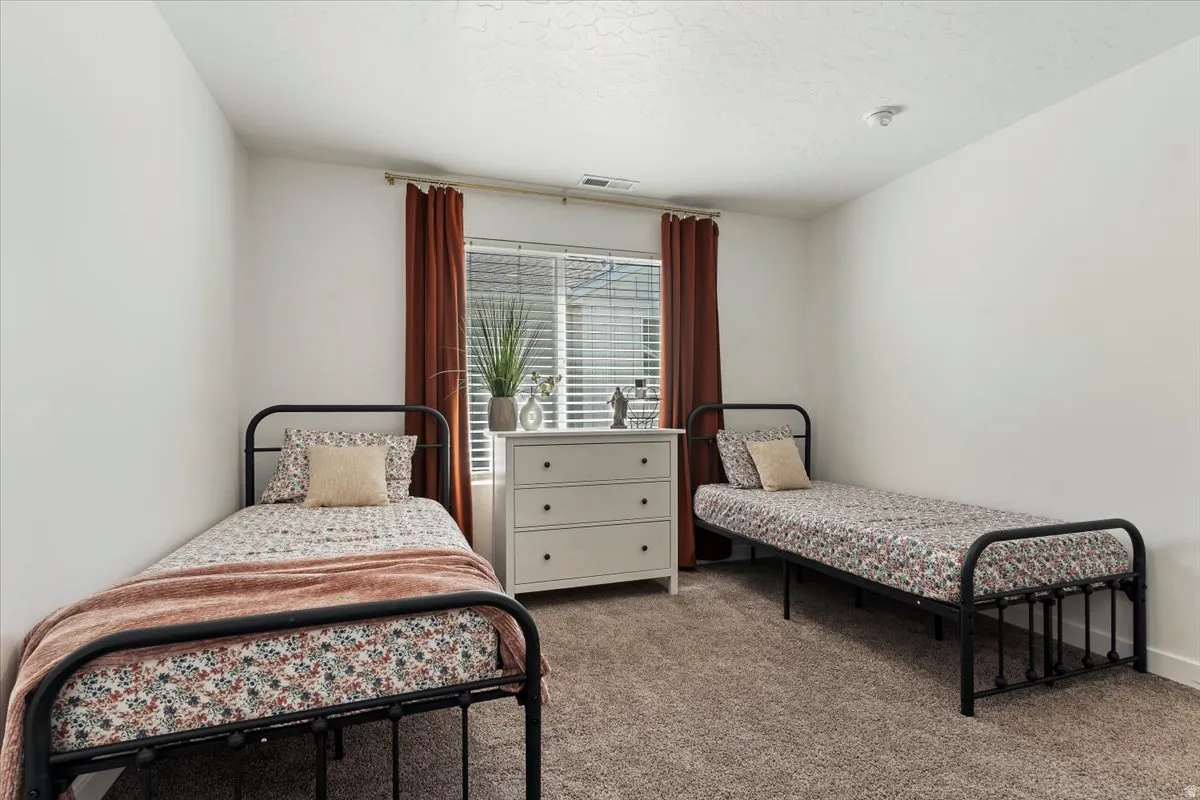 Bedroom featuring carpet
