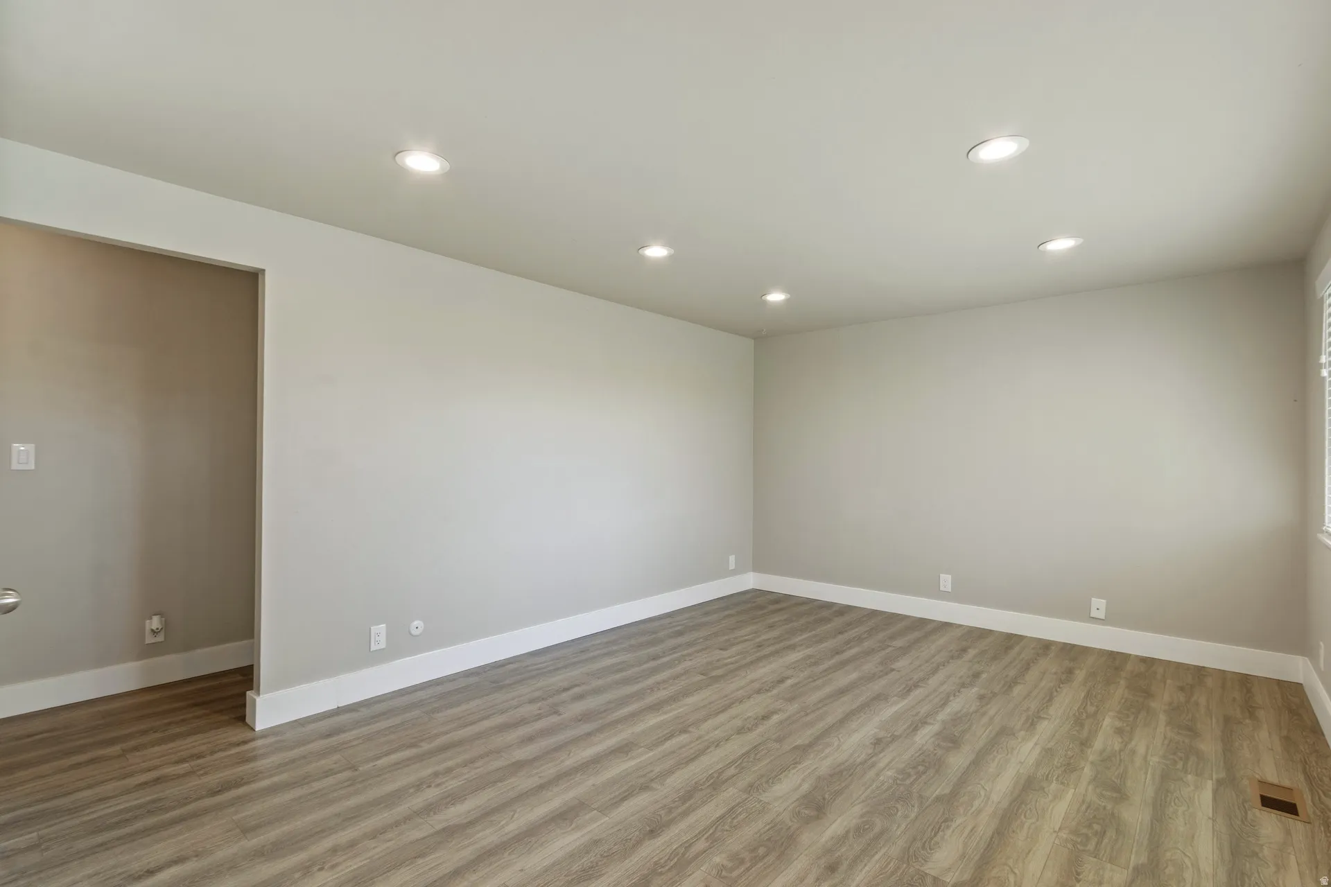 Spare room featuring recessed lighting and light wood-style flooring