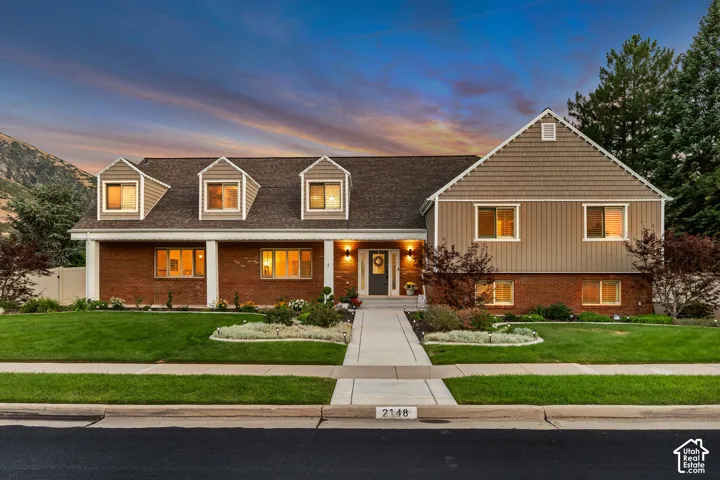 Brick and shingle exterior with dormer windows