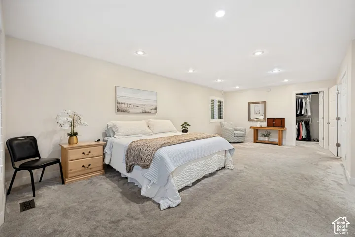 Expansive Primary Bedroom with Walk in Closet that features plumbed laundrey