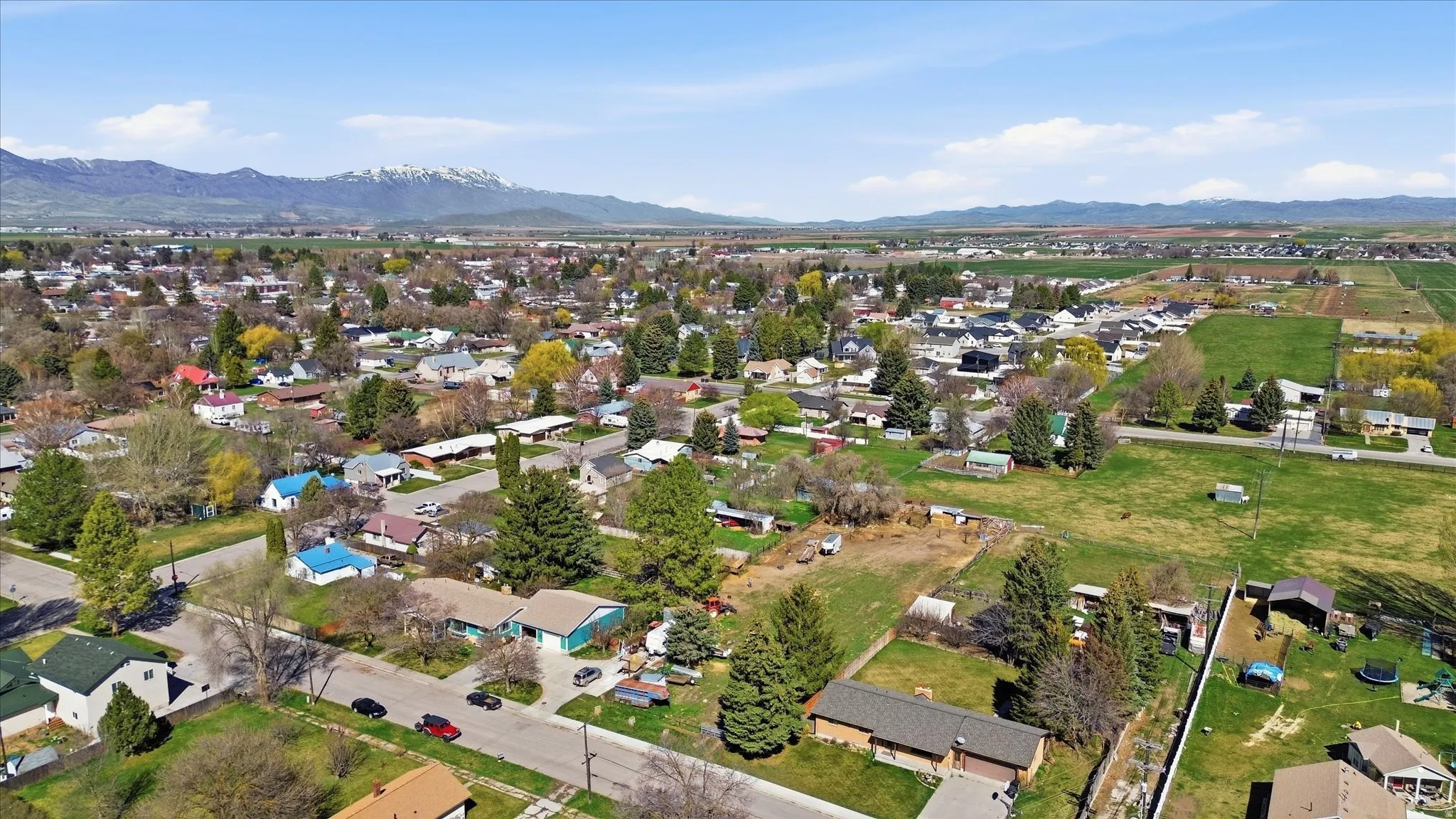 Aerial view of residential area featuring a mountainous background