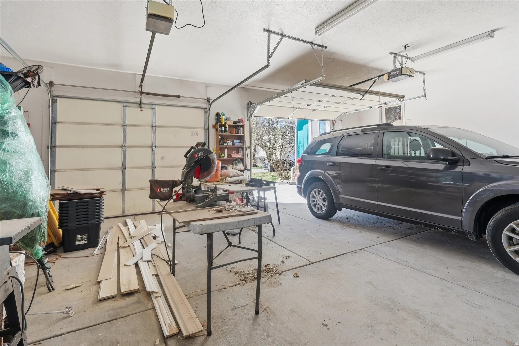 Garage with two separate garage doors each with a garage door opener